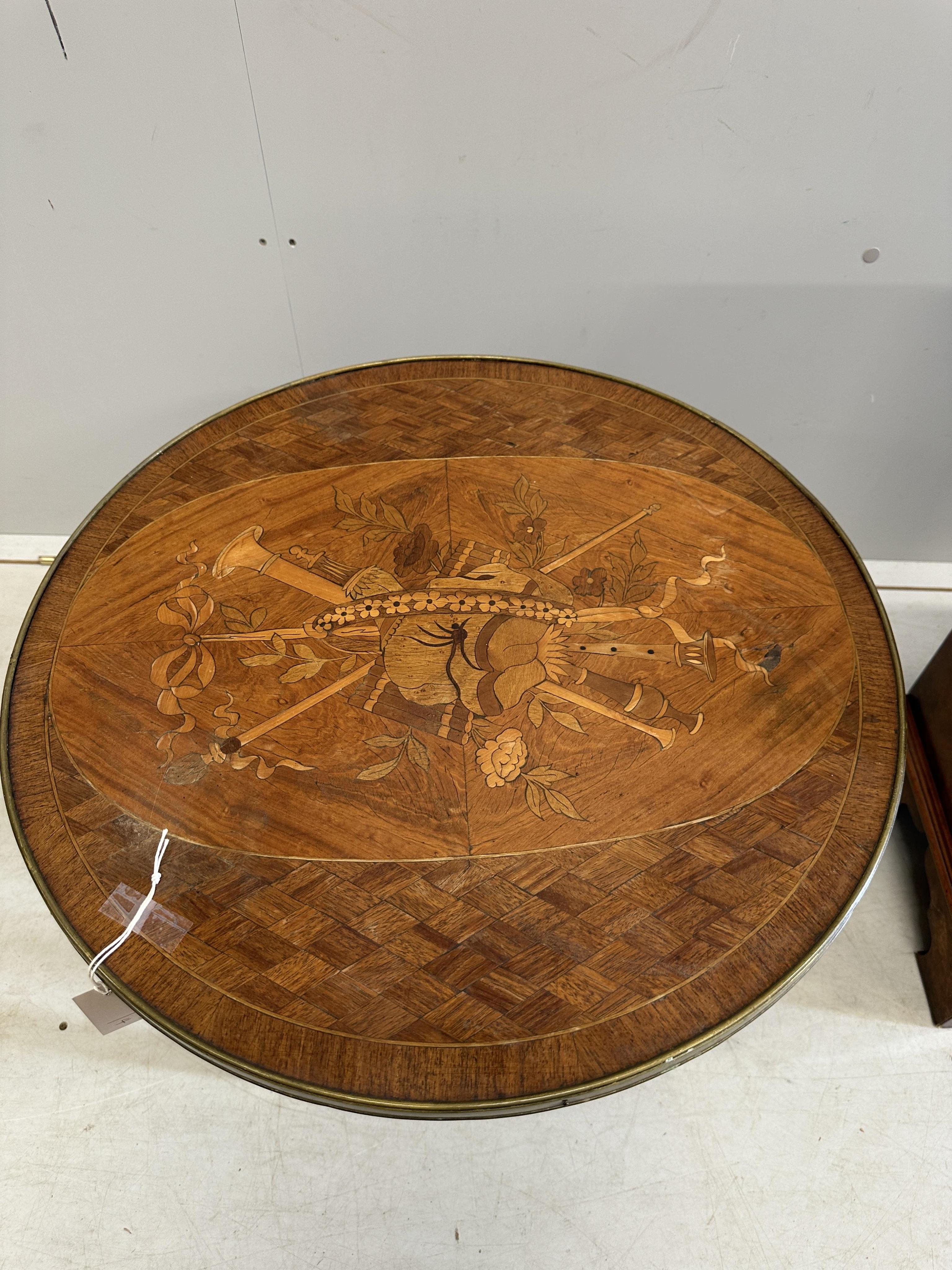 A French Transitional style circular marquetry inlaid coffee table, diameter 59cm, height 46cm together with a walnut speaker cabinet. Condition - poor to fair